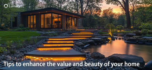 A stunning modern home with dramatic landscape lighting at dusk.